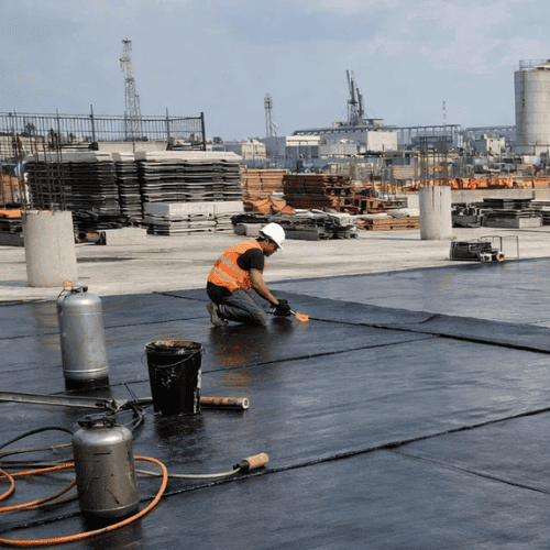 Symbole graphique représentant une surface protégée contre l’humidité dans un contexte d’étanchéité pour bâtiments à Oka